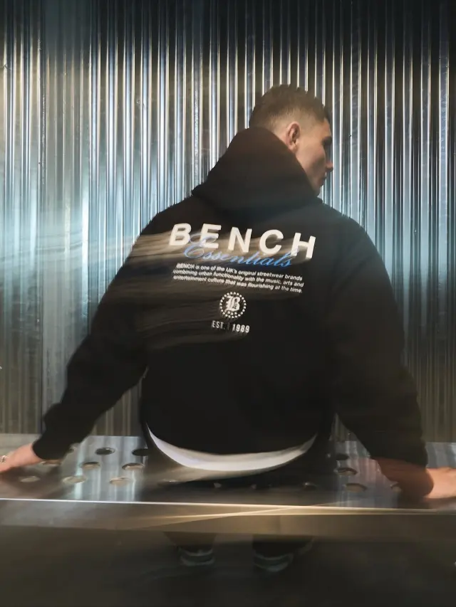 Lutfi Al Fathi seen from behind in a black Bench hoodie