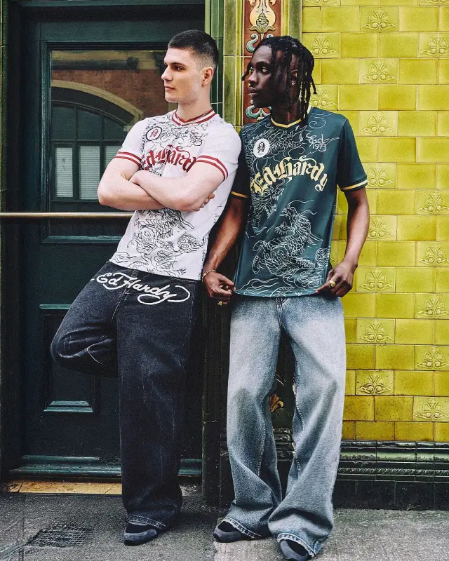 Lutfi Al Fathi with another model in Ed Hardy outside a tiled pub front